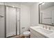 Bathroom features a glass-door shower, a marble countertop sink, and brushed nickel fixtures at 4511 S Manhattan Ave # 18, Tampa, FL 33611