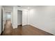 Bright bedroom features wood floors, white walls, and a closet with sliding doors at 4511 S Manhattan Ave # 18, Tampa, FL 33611