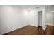 Bedroom features dark wood floors, a closet, and ample space for personalized decor at 4511 S Manhattan Ave # 18, Tampa, FL 33611