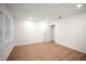 Well-lit bedroom features wood-look flooring, a closet, and a neutral color palette at 4511 S Manhattan Ave # 18, Tampa, FL 33611