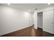 Light, bright bedroom with wood floors, white trim and walls, and closet with sliding doors at 4511 S Manhattan Ave # 18, Tampa, FL 33611