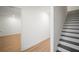 Bright entryway showcasing wood floors, white trim, and a staircase with dark treads at 4511 S Manhattan Ave # 18, Tampa, FL 33611