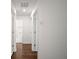 Hallway with dark wood flooring, white walls, and doorways leading to other rooms at 4511 S Manhattan Ave # 18, Tampa, FL 33611