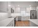 Updated kitchen with stainless appliances, white subway tile backsplash, and quartz countertops at 4511 S Manhattan Ave # 18, Tampa, FL 33611