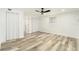 Bright bedroom with a ceiling fan, wood-look flooring, and natural light at 4527 W Clifton St, Tampa, FL 33614