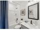 Clean bathroom featuring a tub, shower combo, vanity with stylish finishes and modern fixtures at 4754 Easter Ter, North Port, FL 34286