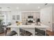 Open-concept kitchen with island seating, stainless steel appliances, and modern countertops at 4754 Easter Ter, North Port, FL 34286