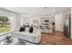 Inviting living room with stylish furniture flowing into an open kitchen with a breakfast bar at 4754 Easter Ter, North Port, FL 34286