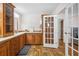 The bathroom features a double sink vanity, a tower cabinet, and access doors to other rooms at 4946 Blanco Dr, Zephyrhills, FL 33541