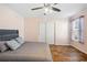 Bedroom featuring wood laminate floors and neutral wall paint at 4946 Blanco Dr, Zephyrhills, FL 33541