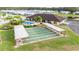 Community area with a large pool, clubhouse, shuffleboard, and seating at 4946 Blanco Dr, Zephyrhills, FL 33541