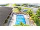 Overhead view of the community pool with seating and manicured landscaping at 4946 Blanco Dr, Zephyrhills, FL 33541