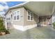 This home features neutral siding, a covered carport, and a patterned concrete driveway at 4946 Blanco Dr, Zephyrhills, FL 33541