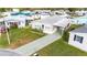 Well maintained single-story home with an extended driveway and manicured lawn at 4946 Blanco Dr, Zephyrhills, FL 33541