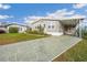Charming single-story home featuring a covered carport and a well-maintained front yard at 4946 Blanco Dr, Zephyrhills, FL 33541