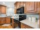 Close up on a kitchen showcasing granite countertops and black stainless steel appliances at 4946 Blanco Dr, Zephyrhills, FL 33541