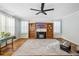 Comfortable living room featuring built-in bookshelves and plenty of natural light at 4946 Blanco Dr, Zephyrhills, FL 33541