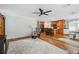 A spacious living area opens to a kitchen with an island and bar seating at 4946 Blanco Dr, Zephyrhills, FL 33541