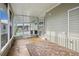 Enclosed porch with a concrete floor, screen windows, and an exterior door at 4946 Blanco Dr, Zephyrhills, FL 33541
