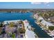 Aerial view of waterfront condos with boat docks along a canal and a location marker at 5006 Starfish Se Dr # A, St Petersburg, FL 33705