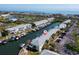 Aerial view of waterfront condo community showcasing boat docks along a canal, marked with home icon at 5006 Starfish Se Dr # A, St Petersburg, FL 33705