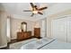 Bedroom featuring wood floors, ceiling fan, and a neutral color palette at 6216 Anhinga Pl, Tampa, FL 33615