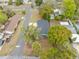 An aerial view of a house showing the layout of the property, the nearby roads, and the surrounding lush vegetation at 6232 Jackson St, New Port Richey, FL 34653