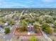 Aerial view of a charming home with a large lot and mature trees in a quiet neighborhood at 6232 Jackson St, New Port Richey, FL 34653