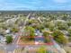 Sprawling aerial view of charming home nestled among mature trees in a quiet neighborhood at 6232 Jackson St, New Port Richey, FL 34653