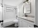 Remodeled bathroom featuring white subway tile and granite vanity at 6232 Jackson St, New Port Richey, FL 34653