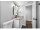 Bathroom featuring granite vanity and black fixtures at 6232 Jackson St, New Port Richey, FL 34653