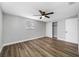 Bedroom featuring vinyl floors, large windows, and a spacious closet at 6232 Jackson St, New Port Richey, FL 34653