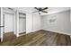 Well-lit bedroom with wood-look floors, closet, and large window at 6232 Jackson St, New Port Richey, FL 34653