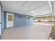 A spacious carport attached to a charming blue house at 6232 Jackson St, New Port Richey, FL 34653