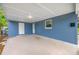 A spacious carport attached to a charming blue house at 6232 Jackson St, New Port Richey, FL 34653