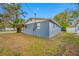 Exterior side and back view of property with lush green grass at 6232 Jackson St, New Port Richey, FL 34653
