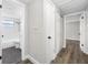 Hallway with access to the bathroom and bedrooms featuring vinyl flooring at 6232 Jackson St, New Port Richey, FL 34653
