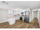 Updated kitchen boasts granite countertops, stainless steel appliances and white cabinets at 6232 Jackson St, New Port Richey, FL 34653