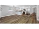 Open-concept kitchen features white cabinets and stainless steel appliances at 6232 Jackson St, New Port Richey, FL 34653