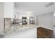 Updated kitchen boasts granite countertops and stainless steel appliances at 6232 Jackson St, New Port Richey, FL 34653