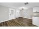 Bright living room featuring hardwood floors, neutral paint, and natural light at 6232 Jackson St, New Port Richey, FL 34653