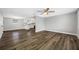 A spacious living room with modern vinyl floors and adjacent kitchen area at 6232 Jackson St, New Port Richey, FL 34653