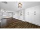 Open-concept living space with view into the kitchen and custom built in cabinets at 6232 Jackson St, New Port Richey, FL 34653