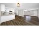 Open-concept living space with view into the kitchen and the bedrooms at 6232 Jackson St, New Port Richey, FL 34653