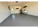 Spacious garage with sealed concrete floor and utility sink at 6753 Thorman Rd, Port Charlotte, FL 33981