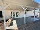 Covered patio featuring a fan, concrete floor, and french doors at 6753 Thorman Rd, Port Charlotte, FL 33981