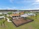 Aerial view of the community playground, clubhouse, and pool in a residential neighborhood at 7608 Broad Pointe Dr, Zephyrhills, FL 33540