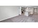 Open floor plan featuring a modern kitchen and living room area at 7608 Broad Pointe Dr, Zephyrhills, FL 33540