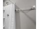The bathroom shows a modern shower with a chrome shower head and white fixtures at 7608 Broad Pointe Dr, Zephyrhills, FL 33540