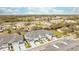 Townhome aerial showcasing the community, landscaping, nearby pond, and neighborhood at 7782 93Rd N St, Seminole, FL 33777